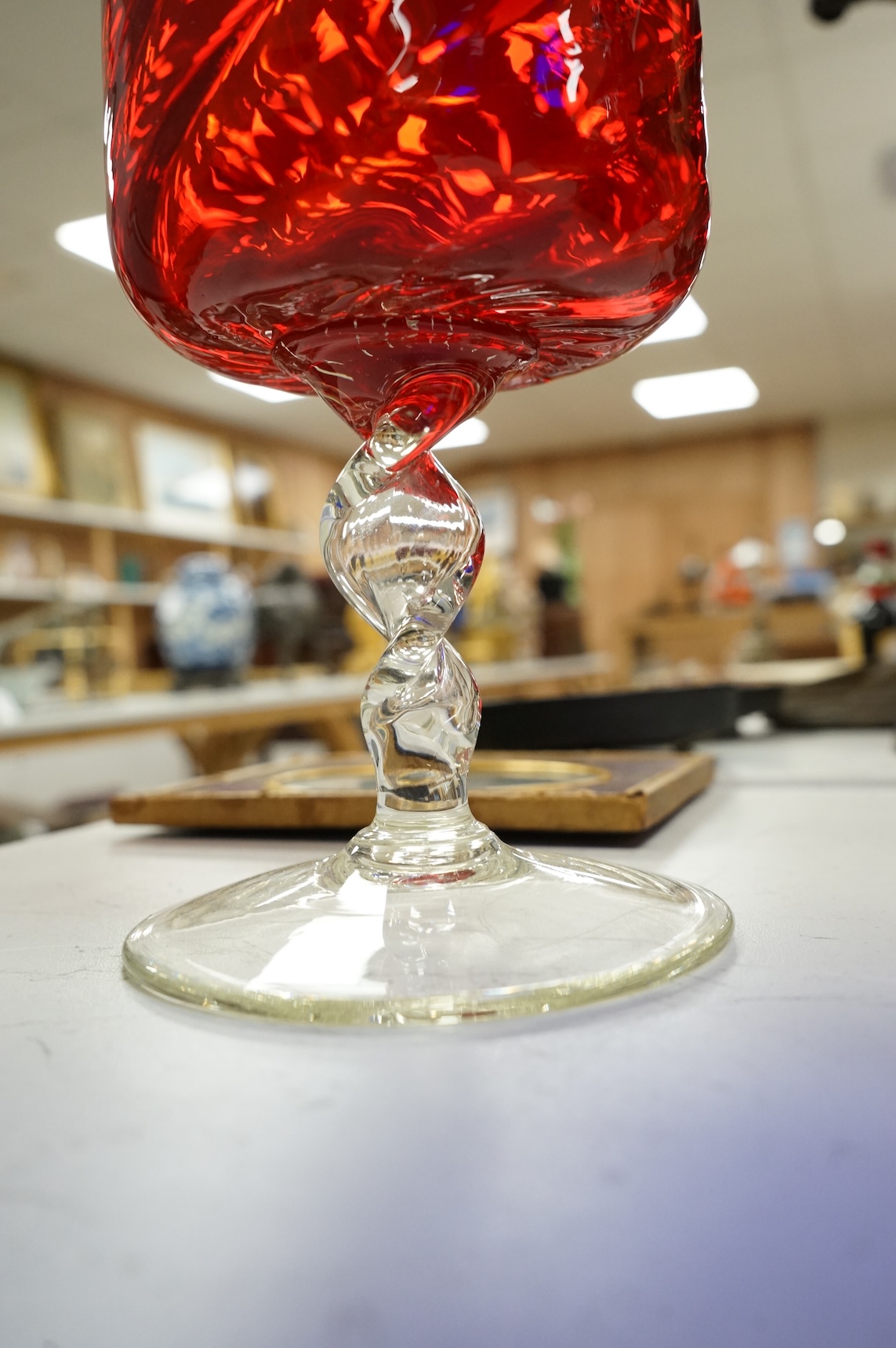 Five pieces of mid-century coloured glassware, to include a jug and an oversized brandy balloon, largest 48cm high